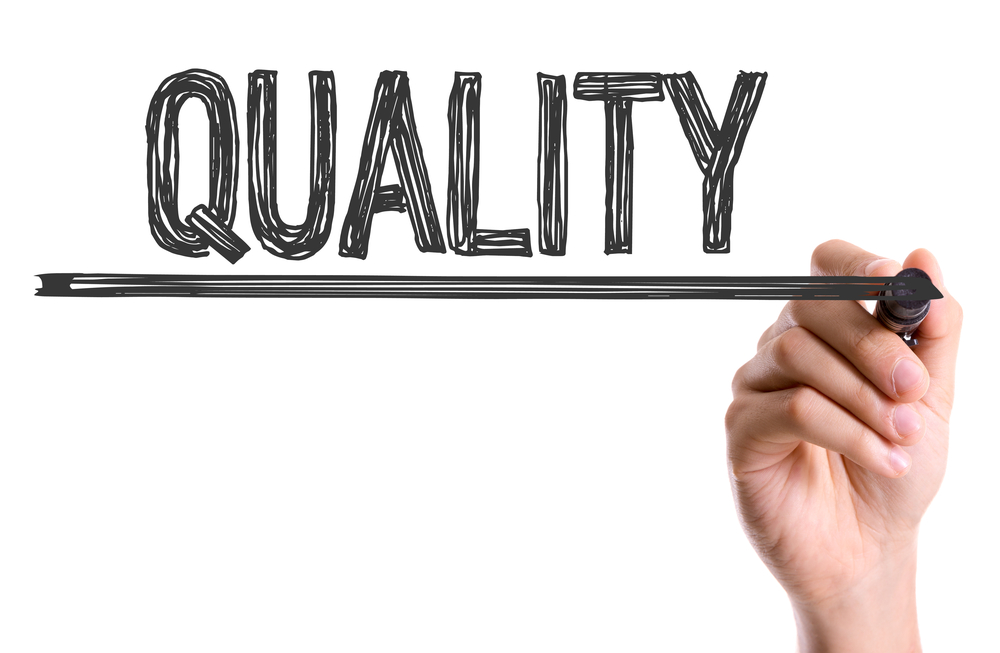 Quality written in black marker all capital letters