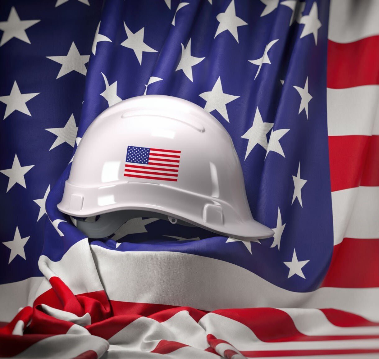 American flag with white construction helmet